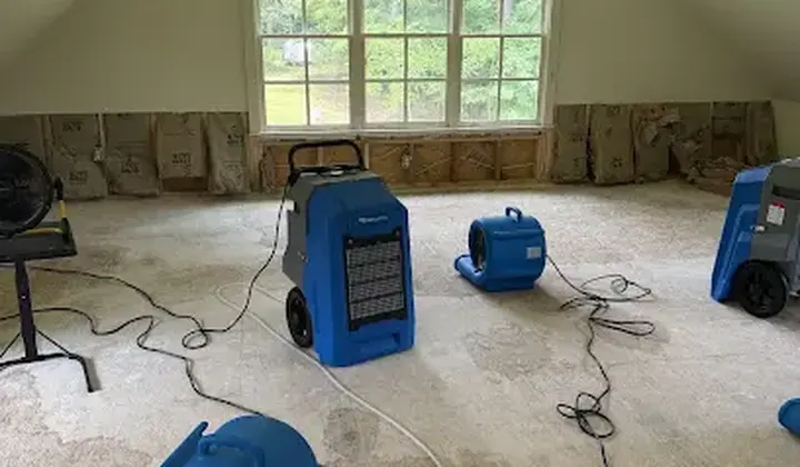 Air movers and a dehumidifier drying a bonus room in Woodstock, GA